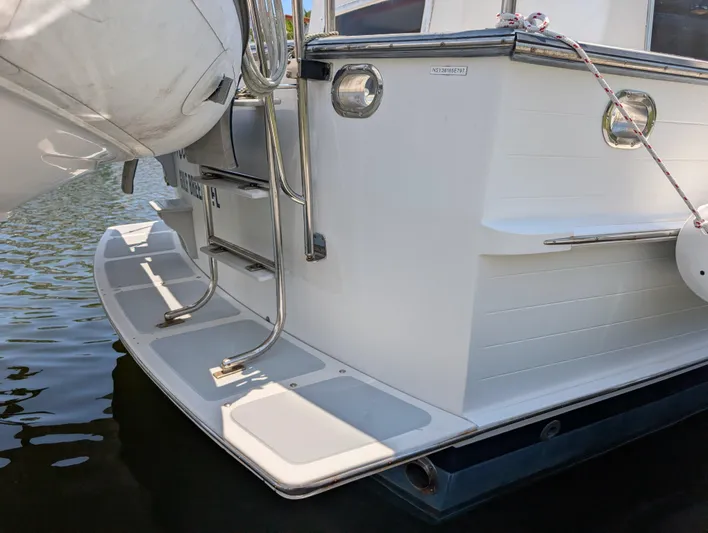 Monarch Yacht Photos Pics Stern view of a 1997 Monk 36 boat with swim platform and ladder.