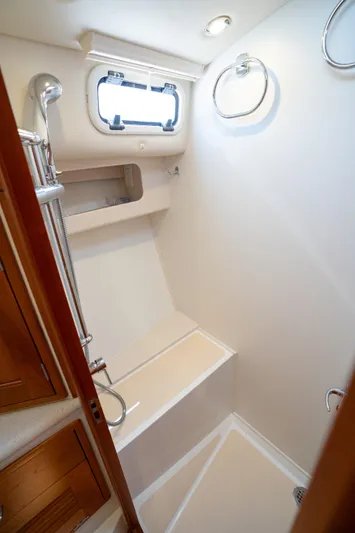 Eagle Wing Yacht Photos Pics 2017 MJM 40z Downeast yacht bathroom with shower and porthole window.