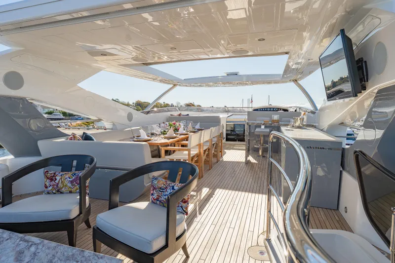 Reunion Yacht Photos Pics Luxurious 2019 Sunseeker 95 Yacht deck with elegant seating and dining area.