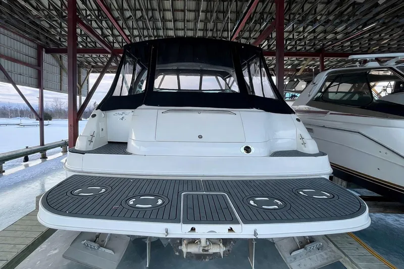  Yacht Photos Pics 1999 Sea Ray Sundancer 460 yacht docked in a covered marina.