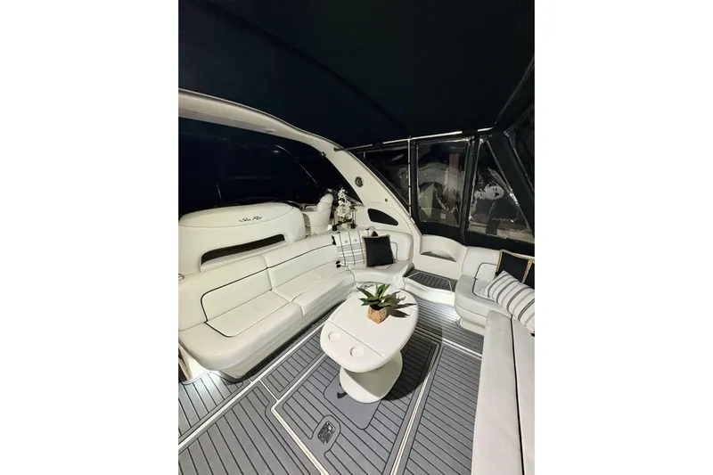  Yacht Photos Pics Luxurious interior of 1999 Sea Ray Sundancer 460 yacht with elegant seating and table.