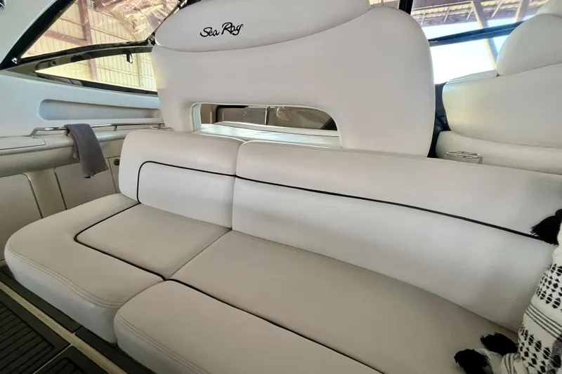 Yacht Photos Pics Interior seating of a 1999 Sea Ray Sundancer 460 yacht, featuring white upholstery.