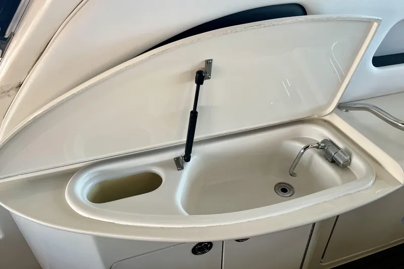  Yacht Photos Pics 1999 Sea Ray Sundancer 460 yacht sink with open cover and faucet.