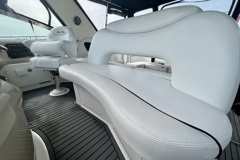  Yacht Photos Pics Interior of 1999 Sea Ray Sundancer 460 with white leather seating and modern design.