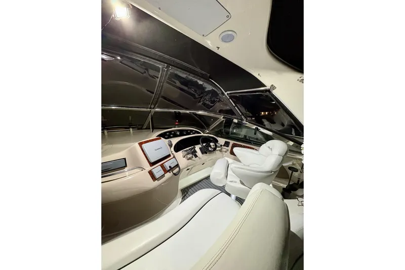  Yacht Photos Pics 1999 Sea Ray Sundancer 460 helm with modern navigation equipment and luxurious seating.