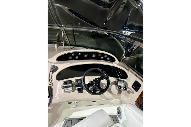  Yacht Photos Pics 1999 Sea Ray Sundancer 460 helm with steering wheel and control panel.