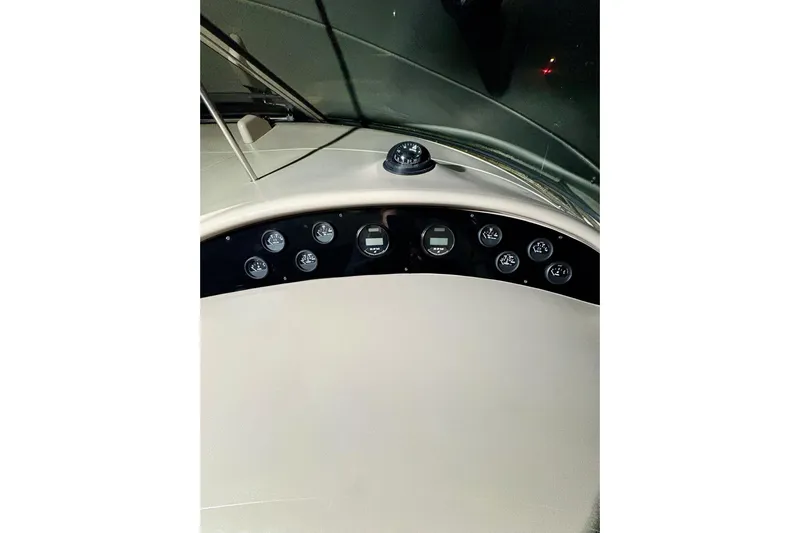  Yacht Photos Pics 1999 Sea Ray Sundancer 460 dashboard with gauges and compass at night.