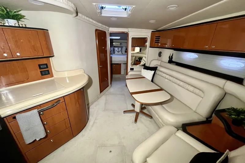  Yacht Photos Pics 1999 Sea Ray Sundancer 460 interior with elegant seating and modern kitchen area.