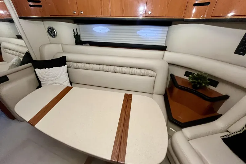  Yacht Photos Pics 1999 Sea Ray Sundancer 460 interior with elegant seating and wooden cabinetry.