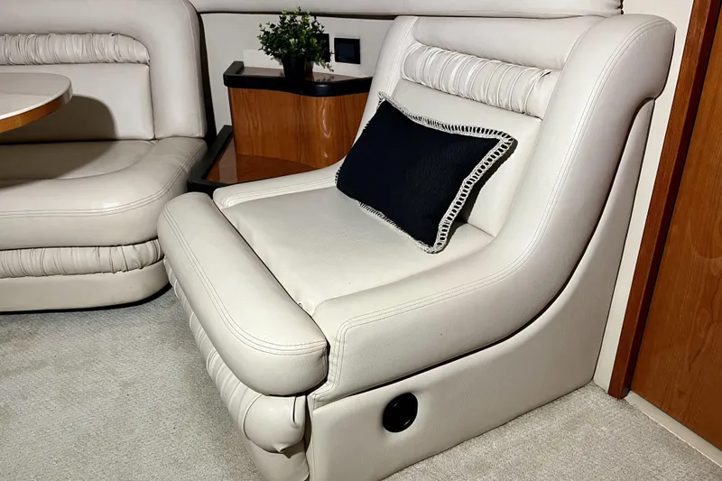  Yacht Photos Pics Luxurious interior seating on 1999 Sea Ray Sundancer 460 yacht with plush white upholstery.
