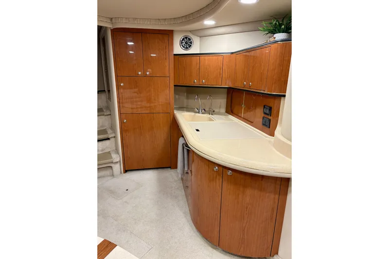  Yacht Photos Pics Luxurious 1999 Sea Ray Sundancer 460 yacht interior with elegant wooden cabinetry and modern amenities.