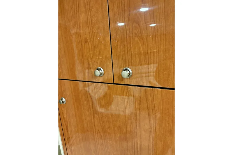  Yacht Photos Pics Wooden cabinet doors with metal knobs on a 1999 Sea Ray Sundancer 460 yacht.