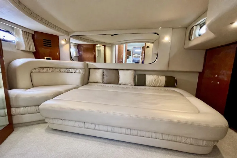  Yacht Photos Pics Luxurious interior of 1999 Sea Ray Sundancer 460 yacht with plush seating and elegant decor.