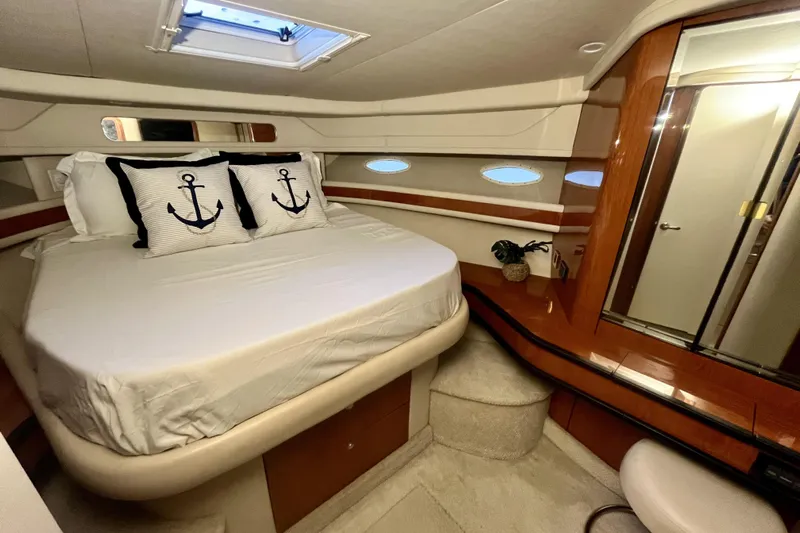  Yacht Photos Pics Luxurious 1999 Sea Ray Sundancer 460 cabin with cozy bed and nautical decor.