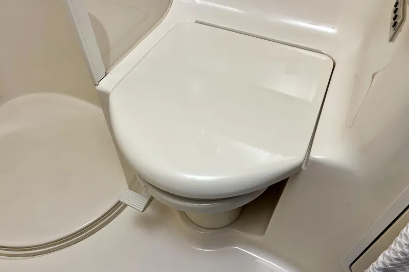  Yacht Photos Pics Toilet in 1999 Sea Ray Sundancer 460 yacht bathroom, featuring a compact design.