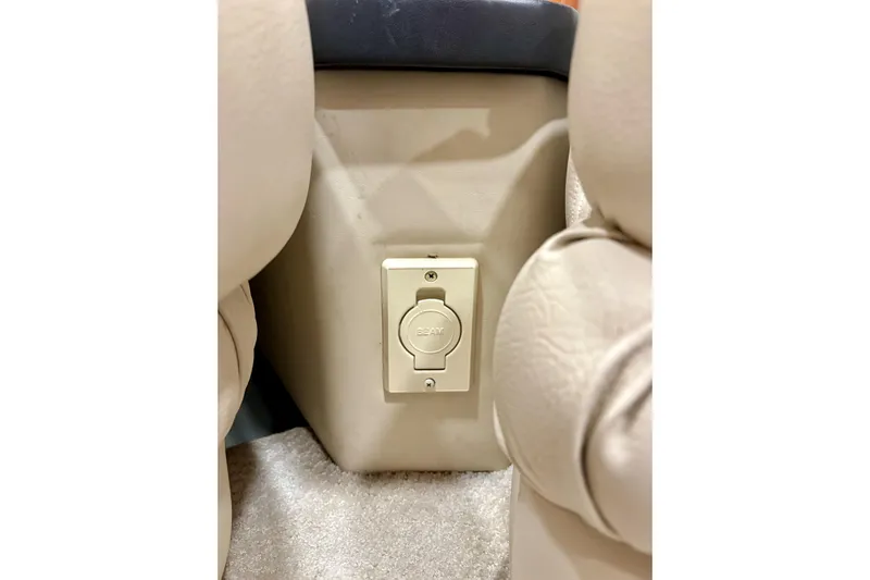  Yacht Photos Pics 1999 Sea Ray Sundancer 460 interior with beige upholstery and power outlet.