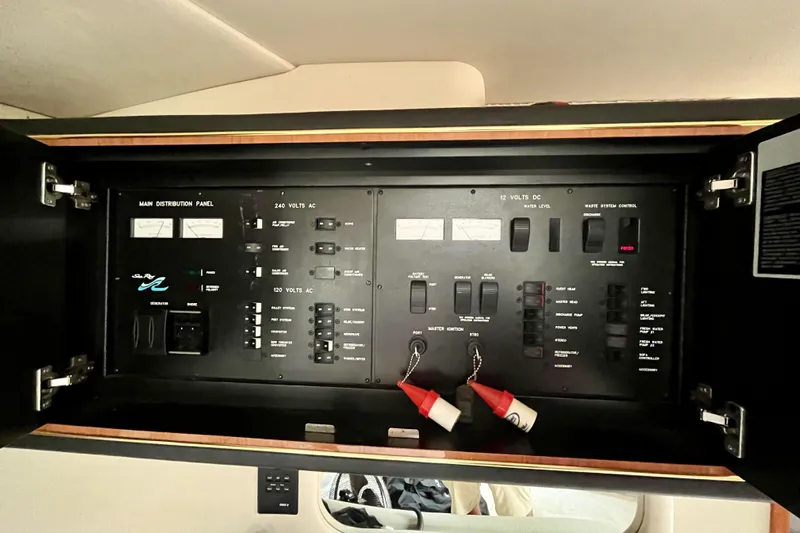  Yacht Photos Pics Main distribution panel of 1999 Sea Ray Sundancer 460 yacht, showcasing electrical controls.