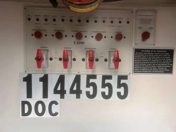 Miss Madison Yacht Photos Pics Control panel of a 2003 Cabo Express boat with switches and labels.