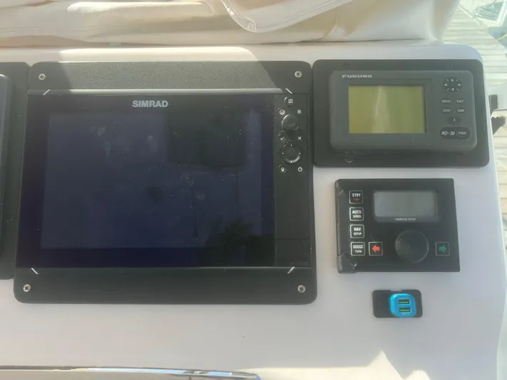 Miss Madison Yacht Photos Pics Boat dashboard with Simrad and Furuno navigation systems, Cabo Express 2003 model.