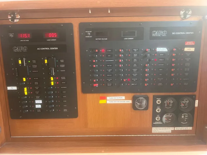 Miss Madison Yacht Photos Pics Electrical control panel of a 2003 Cabo Express boat, featuring AC and DC systems.