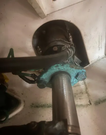 Miss Madison Yacht Photos Pics 2003 Cabo Express boat engine component with visible metal shaft and hoses.