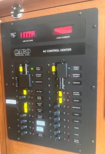 Miss Madison Yacht Photos Pics Cabo Express 2003 AC control center panel with switches and indicators.