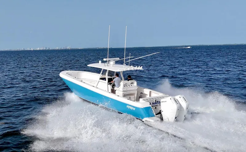 V10 400's Yacht Photos Pics 2015 Intrepid 375 Center Console boat cruising on open water.
