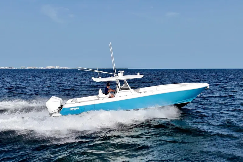 V10 400's Yacht Photos Pics 2015 Intrepid 375 Center Console boat cruising on open water.