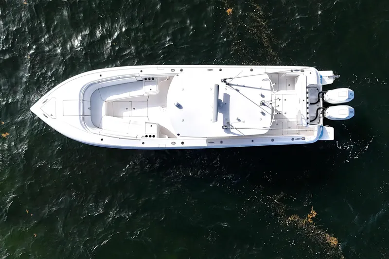 V10 400's Yacht Photos Pics Aerial view of 2015 Intrepid 375 Center Console boat on water.