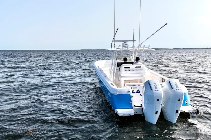 V10 400's Yacht Photos Pics 2015 Intrepid 375 Center Console boat on open water, featuring dual outboard engines.
