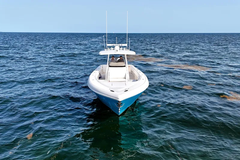 V10 400's Yacht Photos Pics 2015 Intrepid 375 Center Console boat on open sea, clear blue sky.