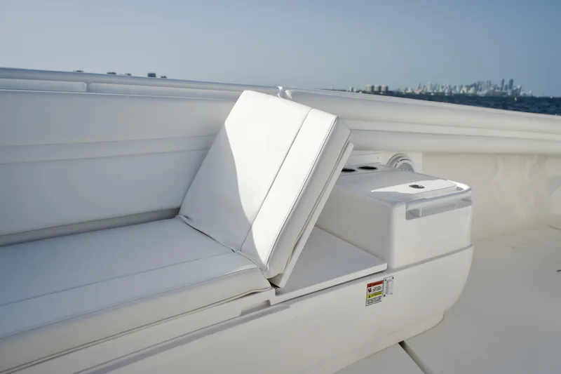V10 400's Yacht Photos Pics 2015 Intrepid 375 Center Console boat with white seating and city skyline in background.
