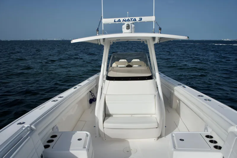 V10 400's Yacht Photos Pics 2015 Intrepid 375 Center Console boat on open water, featuring spacious seating and sleek design.