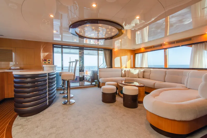 Intrigue Yacht Photos Pics Luxurious interior of 2010 Jade 95 Motor Yacht with elegant seating and bar area.