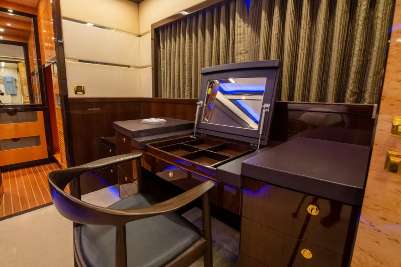 Intrigue Yacht Photos Pics Luxurious interior of 2010 Jade 95 Motor Yacht with elegant vanity and chair.
