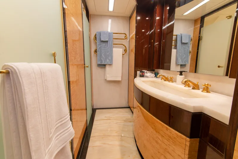 Intrigue Yacht Photos Pics Luxurious bathroom on 2010 Jade 95 Motor Yacht with elegant fixtures and marble accents.