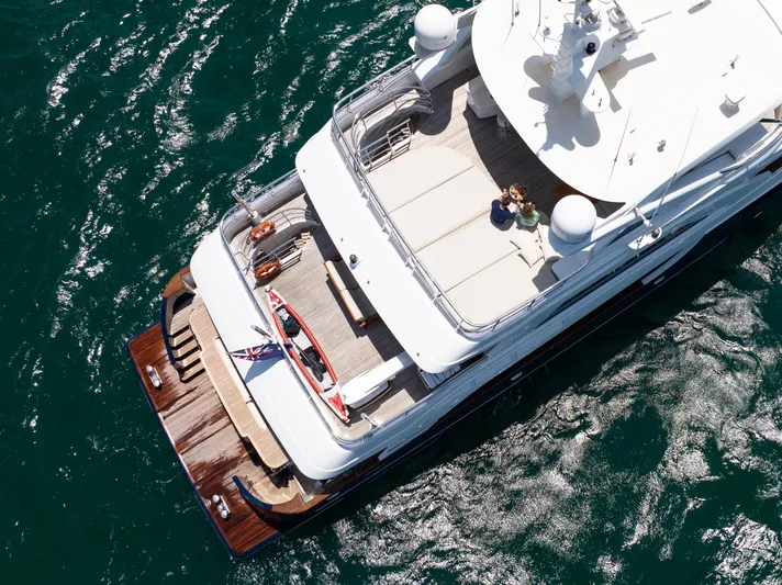 Intrigue Yacht Photos Pics Aerial view of 2010 Jade 95 Motor Yacht cruising on the ocean.