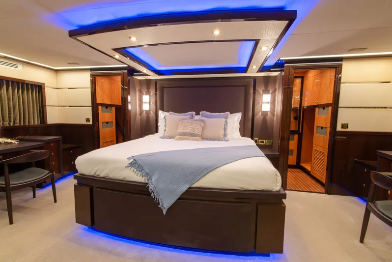 Intrigue Yacht Photos Pics Luxurious bedroom interior of 2010 Jade 95 Motor Yacht with ambient lighting.
