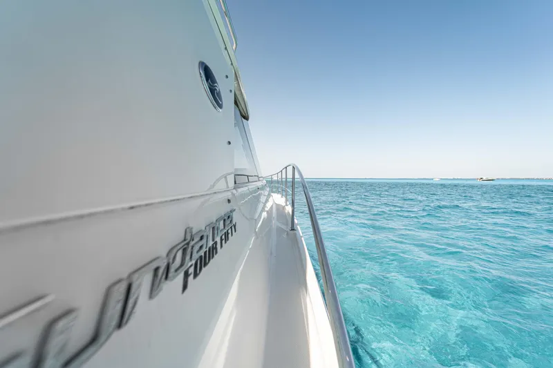 Atm Yacht Photos Pics Side view of 2013 Sea Ray 45 yacht on clear blue ocean.