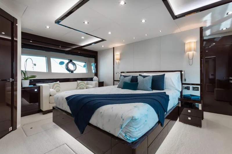 Mirracle Yacht Photos Pics Luxurious bedroom interior of 2018 Sunseeker 95 Yacht with elegant decor and modern furnishings.