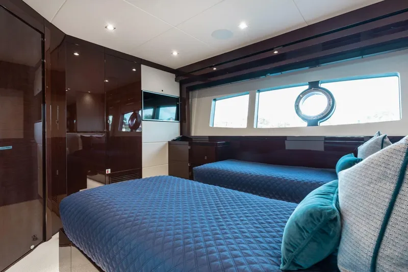 Mirracle Yacht Photos Pics Luxurious 2018 Sunseeker 95 Yacht bedroom with twin beds and elegant decor.