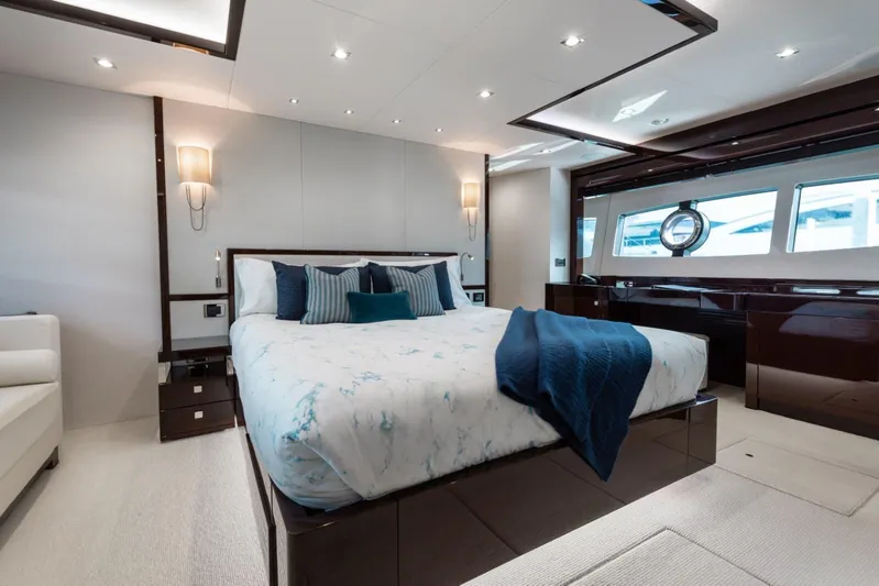 Mirracle Yacht Photos Pics Luxurious bedroom interior on 2018 Sunseeker 95 Yacht with elegant decor and large windows.