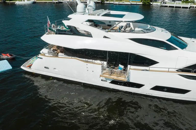 Mirracle Yacht Photos Pics 2018 Sunseeker 95 Yacht on water, showcasing sleek design and luxurious features.