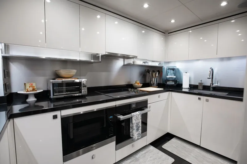 Mirracle Yacht Photos Pics Luxurious kitchen interior on a 2018 Sunseeker 95 Yacht, featuring modern appliances and sleek design.