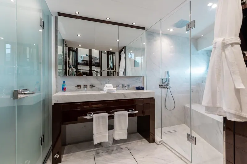 Mirracle Yacht Photos Pics Luxurious bathroom on 2018 Sunseeker 95 Yacht with glass shower and elegant fixtures.