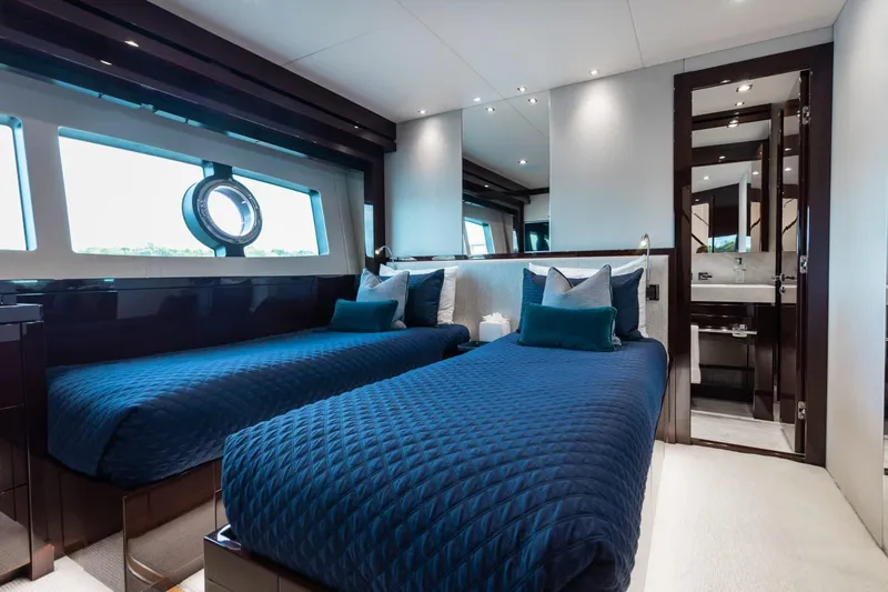 Mirracle Yacht Photos Pics Luxurious twin bedroom on 2018 Sunseeker 95 Yacht with elegant blue bedding.