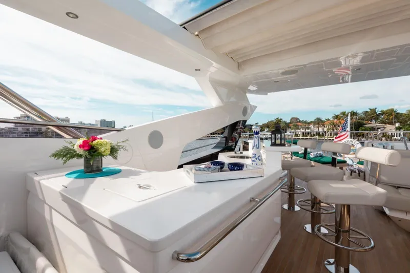 Mirracle Yacht Photos Pics Luxurious Sunseeker 95 Yacht 2018 deck with elegant seating and scenic waterfront view.