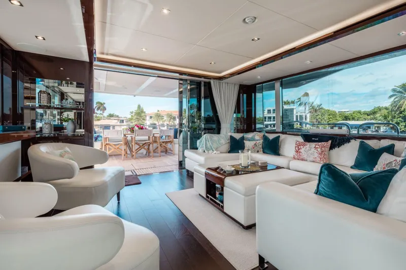 Mirracle Yacht Photos Pics Luxurious interior of 2018 Sunseeker 95 Yacht with elegant seating and outdoor dining area.