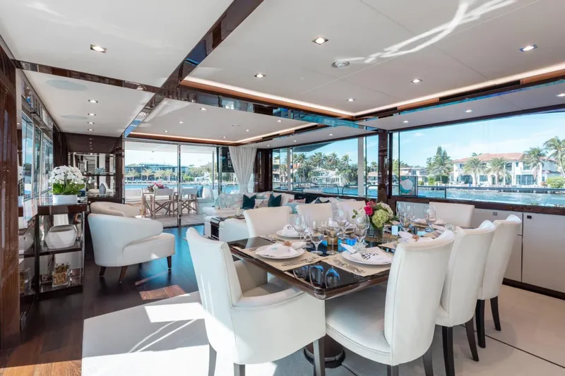 Mirracle Yacht Photos Pics Luxurious interior of 2018 Sunseeker 95 Yacht with elegant dining area and scenic views.