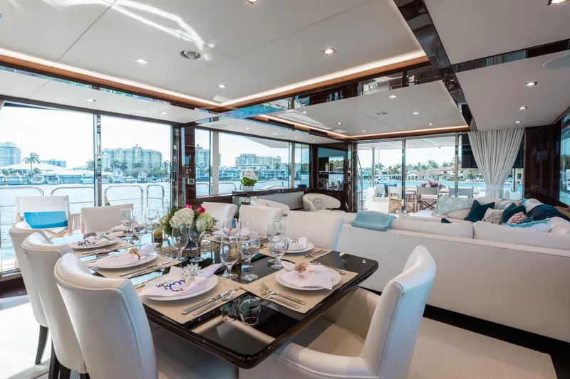 Mirracle Yacht Photos Pics Luxurious interior of 2018 Sunseeker 95 Yacht with elegant dining and seating areas.